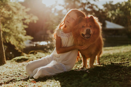 Blog: Not Just a Pretty Scent: How Our Deodorizing Pet Spray Supports Skin Health, image of girl with a dog