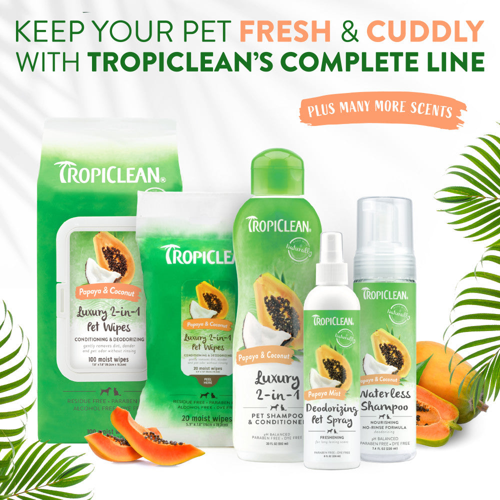 Tropiclean pet care products including shampoo, wipes, and sprays with tropical fruits on a white background.