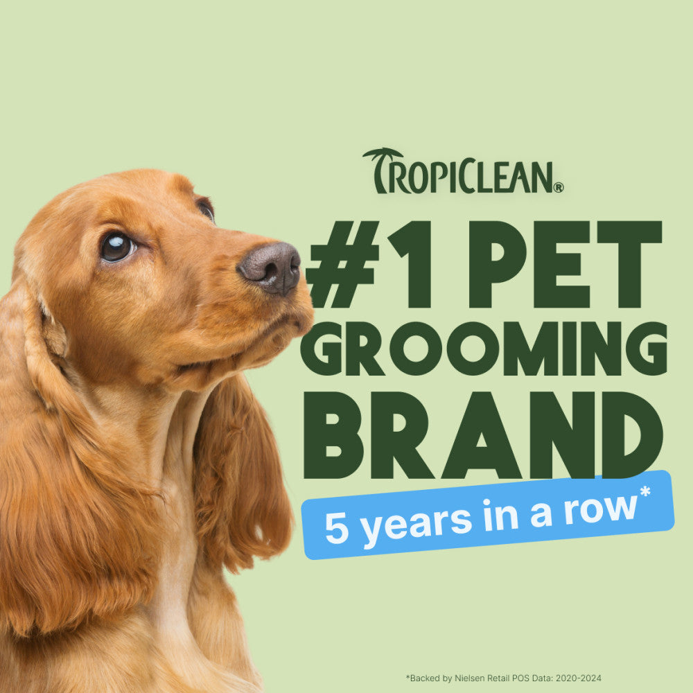 Dog with Tropiclean branding claiming to be #1 pet grooming brand for 5 years in a row on a light green background.