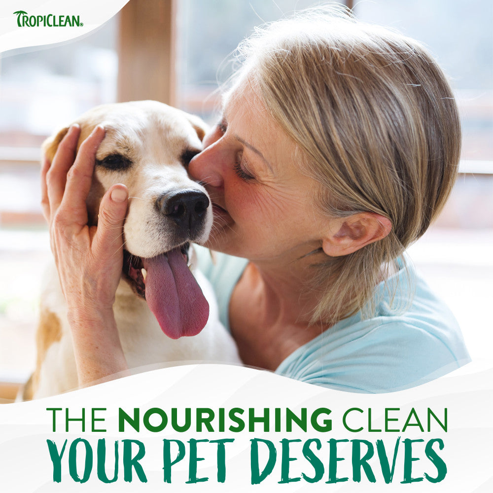 TropiClean Watermelon Refreshing 2-in-1 Pet Shampoo & Conditioner. Woman kissing a dog with text 'The Nourishing Clean Your Pet Deserves' and Tropiclean logo.