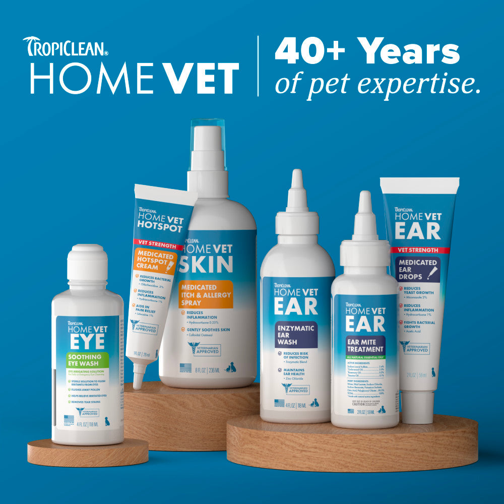 Tropiclean HomeVet pet care products on a wooden stand with a blue background