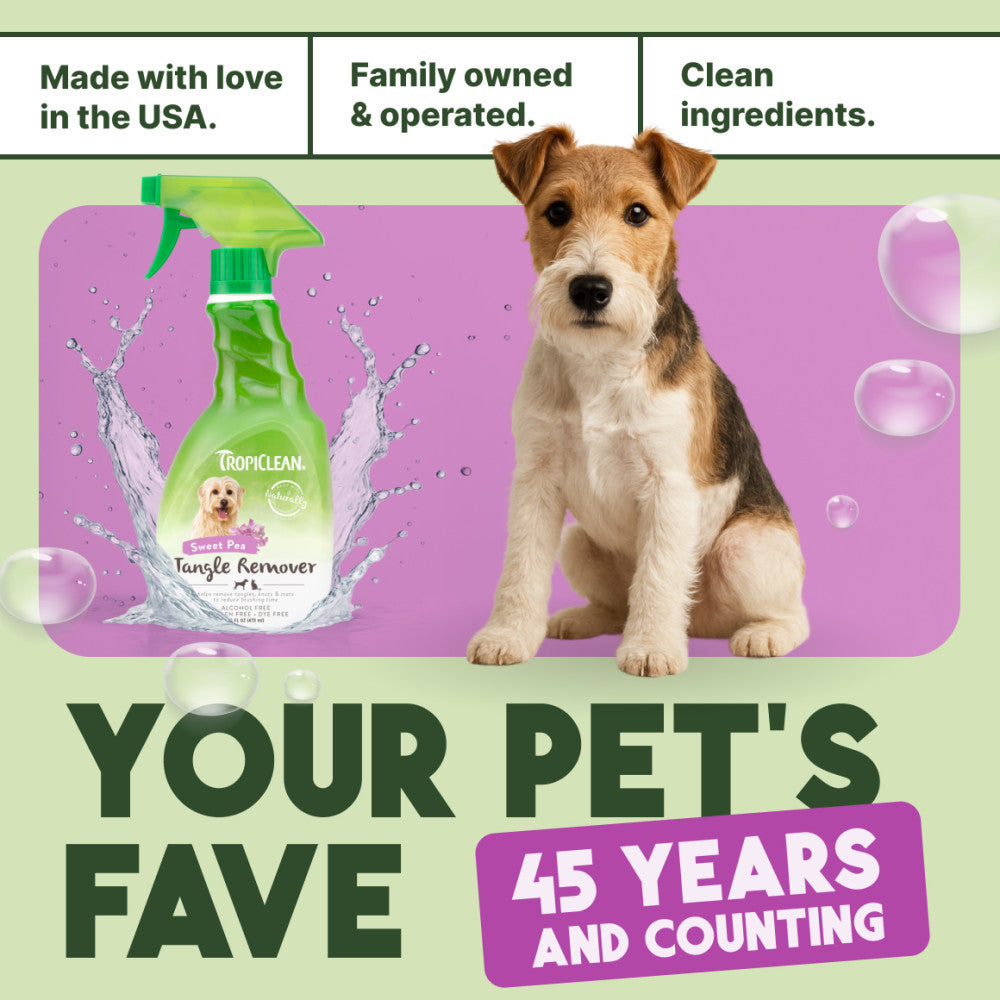 TropiClean Sweet Pea Tangle Remover Spray for Dogs & Cats bottle with a dog and promotional text on a green and purple background