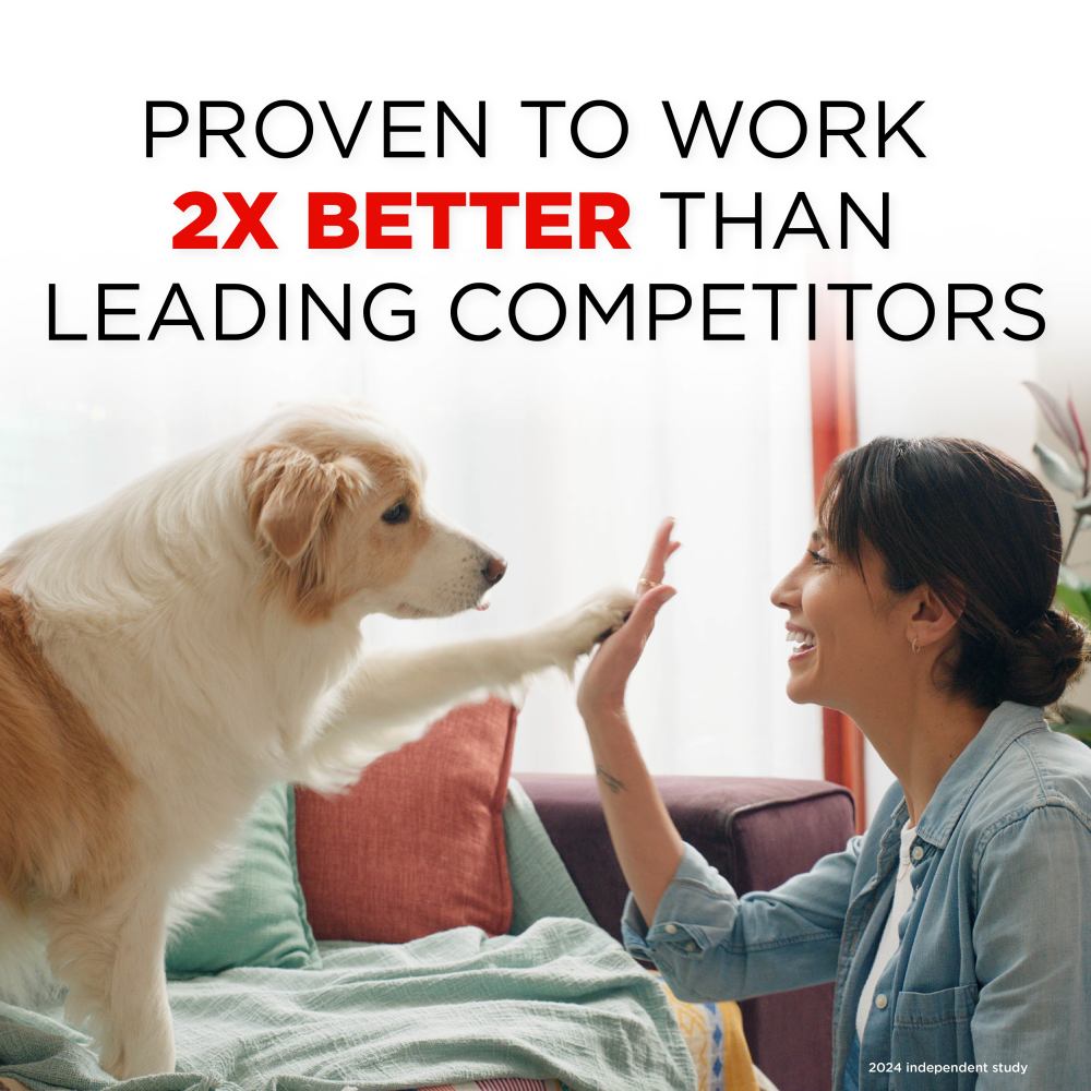 Woman giving a dog a high-five with text claiming effectiveness over competitors of TropiClean Skunk Odor Control Shampoo for Dogs & Cats