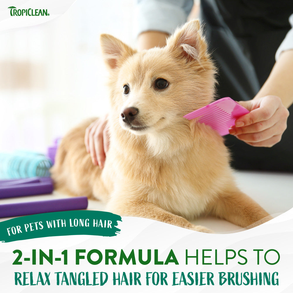 TropiClean Watermelon Refreshing 2-in-1 Pet Shampoo & Conditioner. Dog being groomed with a pink comb, Tropiclean branding visible