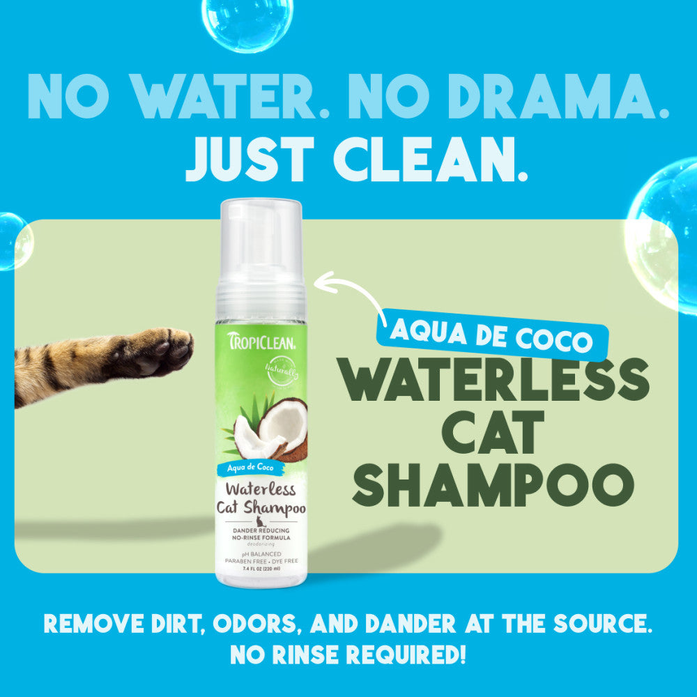Tropiclean Aqua de Coco waterless cat shampoo bottle with promotional text on a blue background