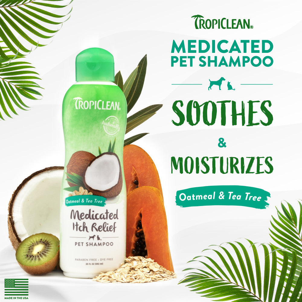 TropiClean Oatmeal & Tea Tree Medicated Itch Relief Shampoo for Pets bottle with coconut, kiwi, and leaves on a white background