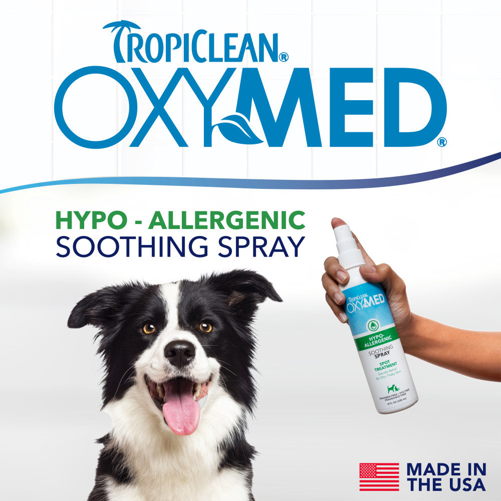 TropiClean OxyMed Hypoallergenic Anti Itch Spray for Dogs and Cats with a dog and a hand holding the spray bottle