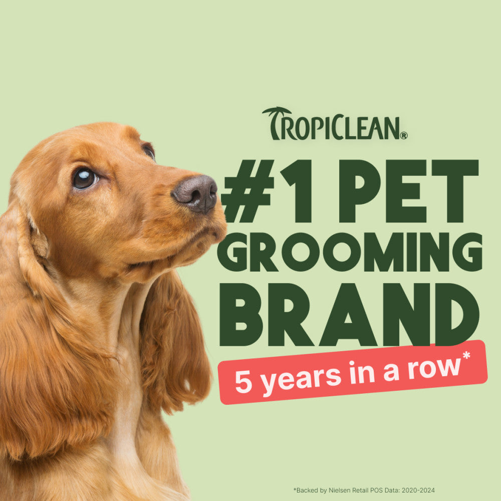 Dog with Tropiclean branding claiming to be #1 pet grooming brand for 5 years in a row on a green background.