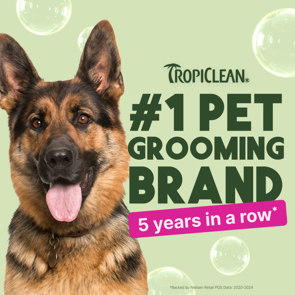 Dog with Tropiclean branding claiming to be #1 pet grooming brand for 5 years in a row on a light green background.