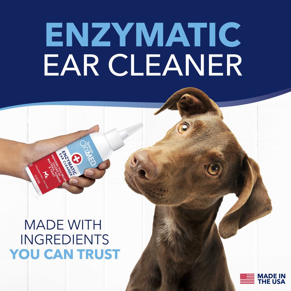 TropiClean OxyMed Enzymatic Ear Cleaner for Pets, dog looking at the product.
