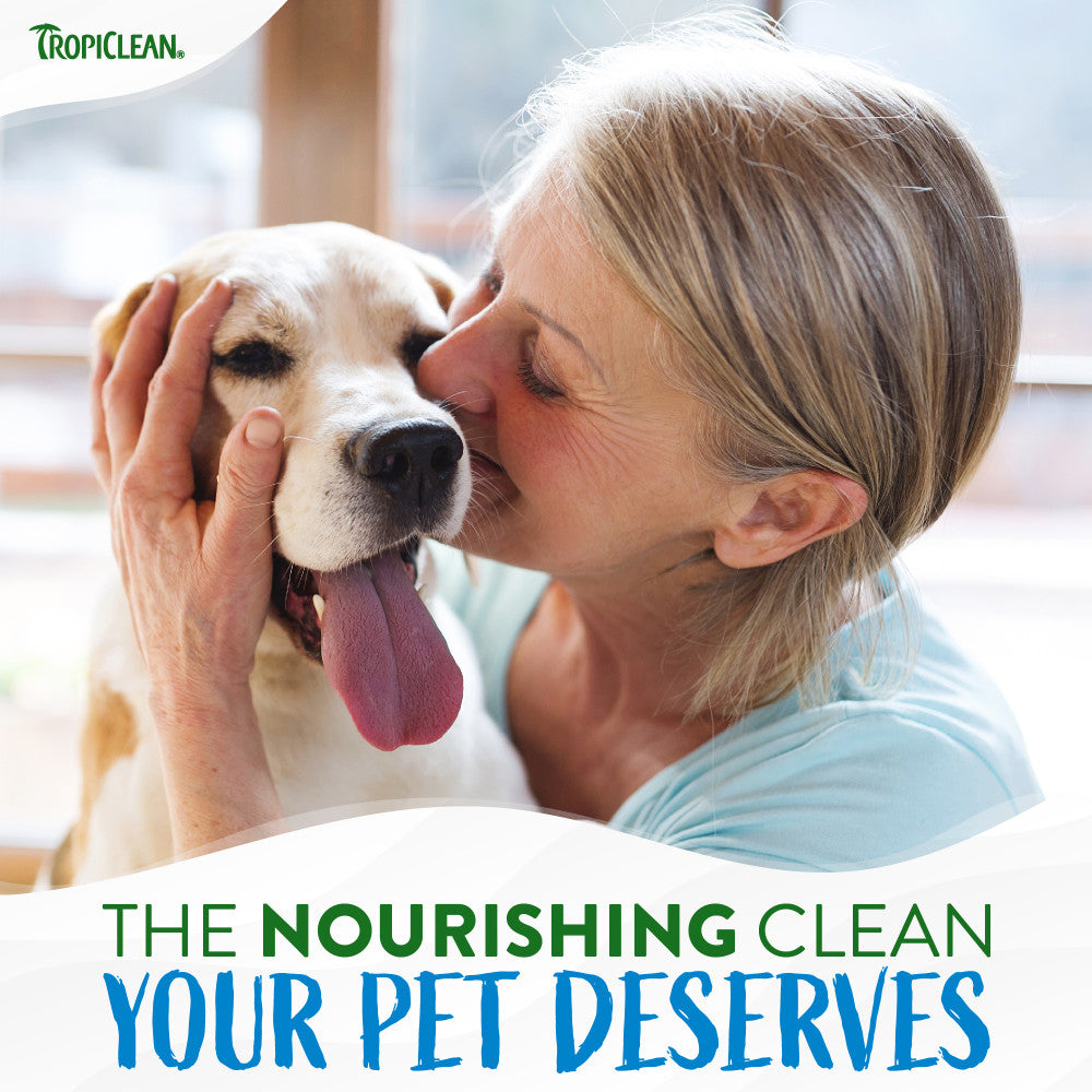 Woman kissing a dog with Tropiclean branding and text about pet care.