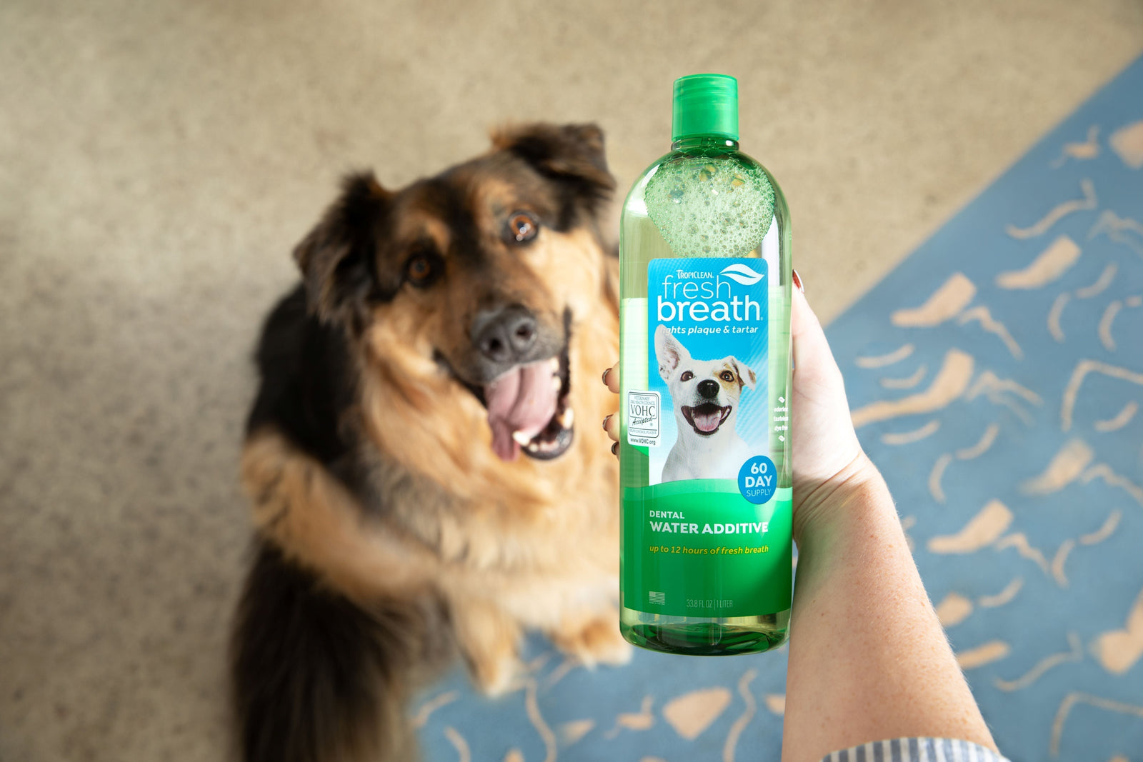 Image of dog with TropiClean Fresh Breath Water Additive for Dogs.
