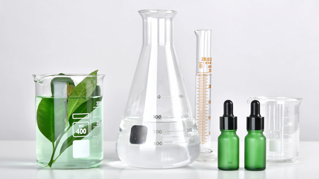 Image of product ingredients in test tubes and beakers.