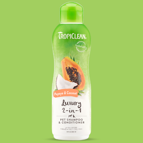 TropiClean Papaya and Coconut 2-In-1 pet shampoo and conditioner, image of bottle on a green background