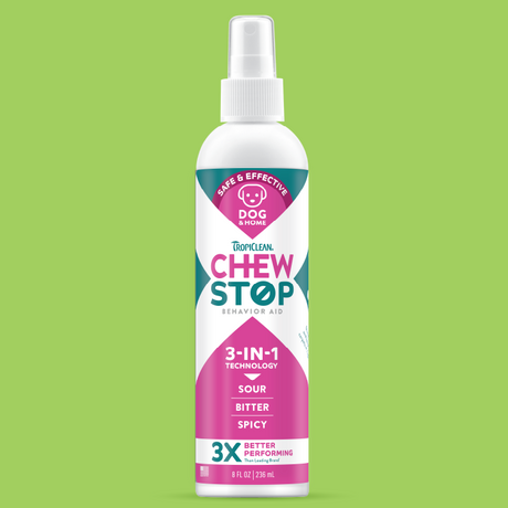 TropiClean Chew Stop spray bottle on a green background