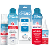 TropiClean OxyMed Cat Grooming 5 Kit. TropiClean OXYMED pet care products including shampoo, rinse, wipes, dry shampoo and ear cleaner on a white background.