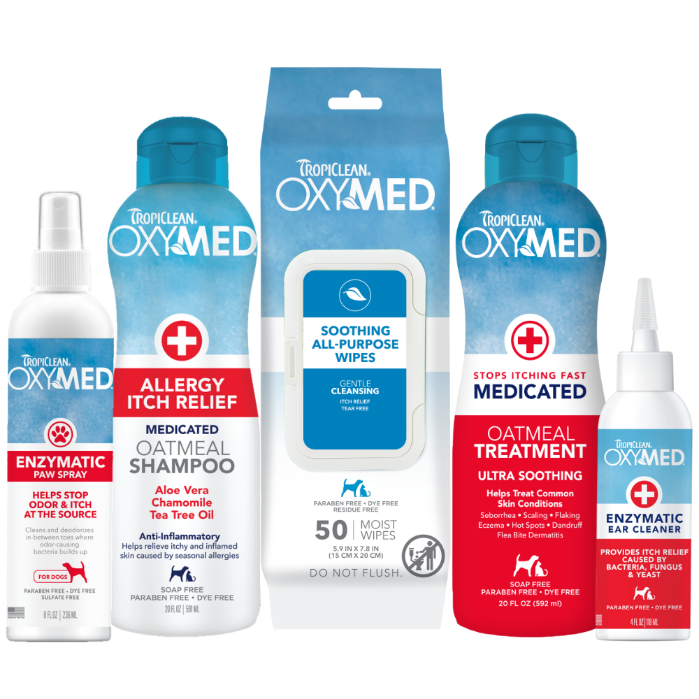 TropiClean OxyMed Itch Relief Dog Grooming 5 Kit. TropiClean OXYMED pet care products including shampoo, rinse, paw spray, wipes, and ear spray on a white background