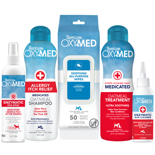 TropiClean OxyMed Itch Relief Dog Grooming 5 Kit. TropiClean OXYMED pet care products including shampoo, rinse, paw spray, wipes, and ear spray on a white background