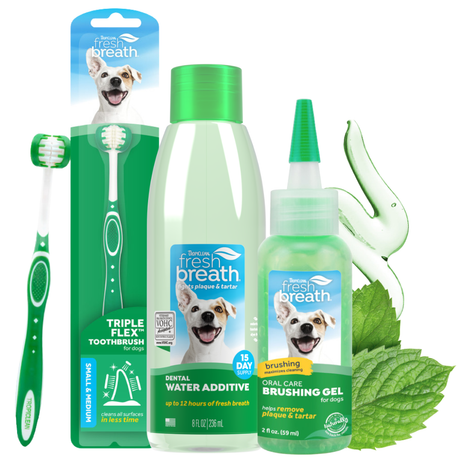 TropiClean Fresh Breath Dog Oral Care 3 Kit. Dog dental care products including a toothbrush, water additive, and gel on a white background.