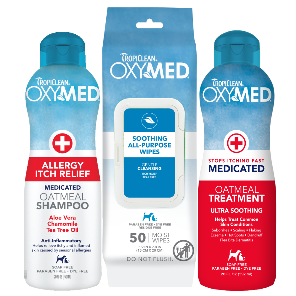 TropiClean OxyMed Itch Relief Pet Grooming 3 Kit. Tropiclean OxyMed pet care itch relief products including shampoo, wipes, and rinse treatment on a white background