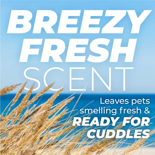 TropiClean PURE Breezy Fresh 2-In-1 Plant-Based Deodorizing Pet Spray, advertisement with text 'Breezy Fresh Scent' and beach scene.
