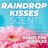 TropiClean PURE Raindrop Kisses Tearless Plant-Based Puppy Shampoo. Pink flower with 'Raindrop Kisses Scent' text on a blue background