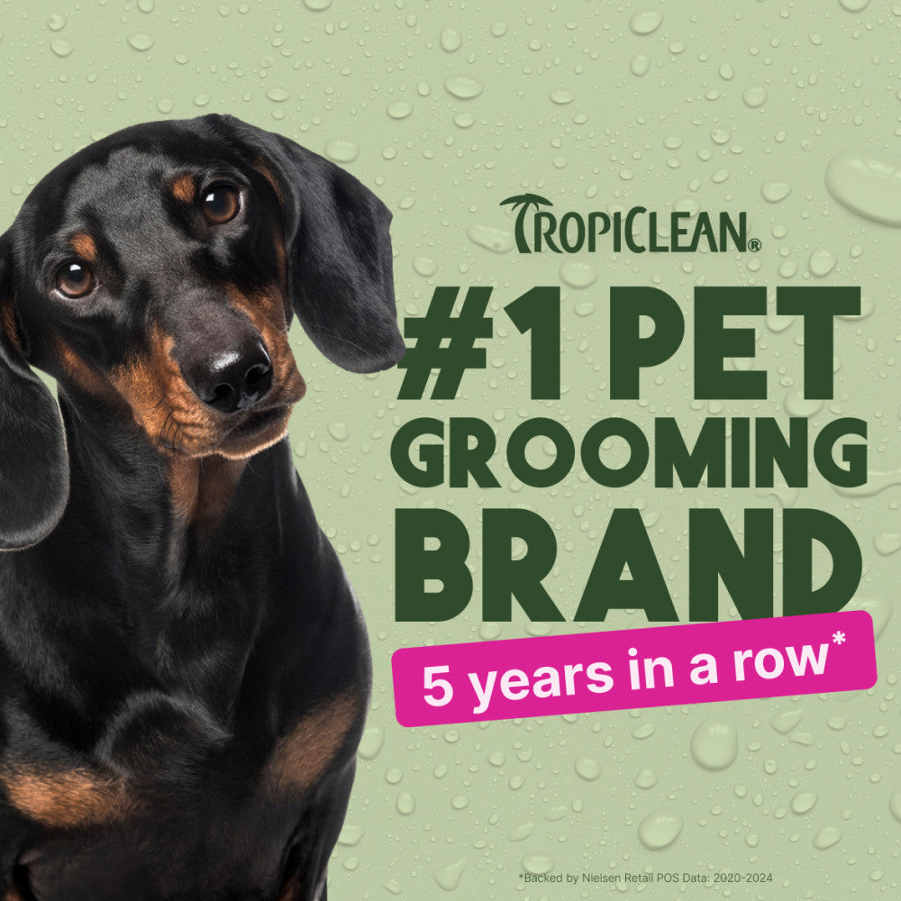 Dog with Tropiclean branding claiming to be #1 pet grooming brand for 5 years in a row on a green background.