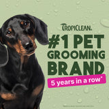 Dog with Tropiclean branding claiming to be #1 pet grooming brand for 5 years in a row on a green background.