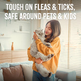 TropiClean Natural Flea + Tick Home + Cat Spray. Woman holding a cat in a living room with text about product safety
