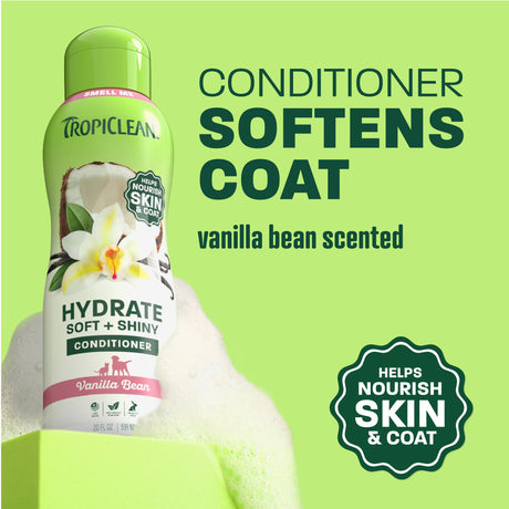 TropiClean vanilla conditioner bottle on light green background.