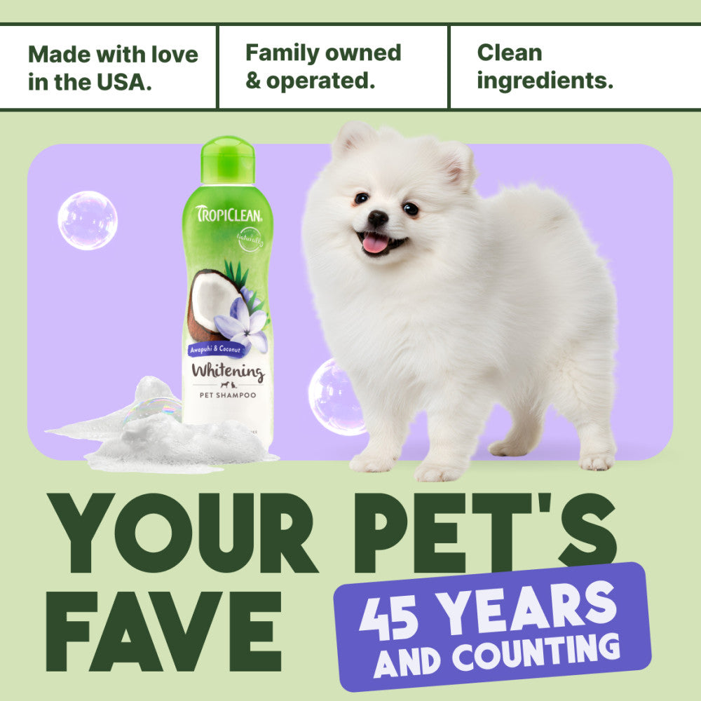 TropiClean dog shampoo bottle with a white dog, featuring text about family ownership and product features.