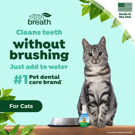 Cat with a bottle of TropiClean Fresh Breath Cat Dental Water Additive Concentrate, with promotional text about the product's benefits.