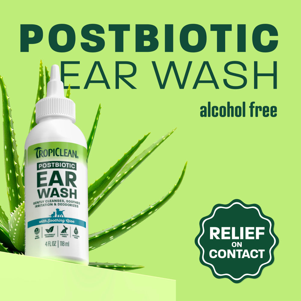 TropiClean ear wash bottle on light green background.