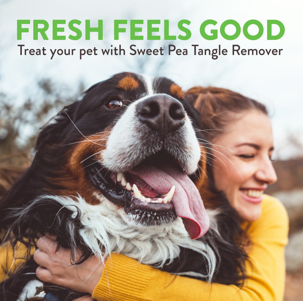 Woman holding a dog with text about TropiClean Sweet Pea Tangle Remover Spray for Dogs & Cats