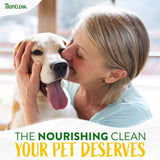 Woman kissing a dog with TropiClean branding and text about pet care.