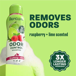 TropiClean raspberry lime shampoo bottle on light green background.