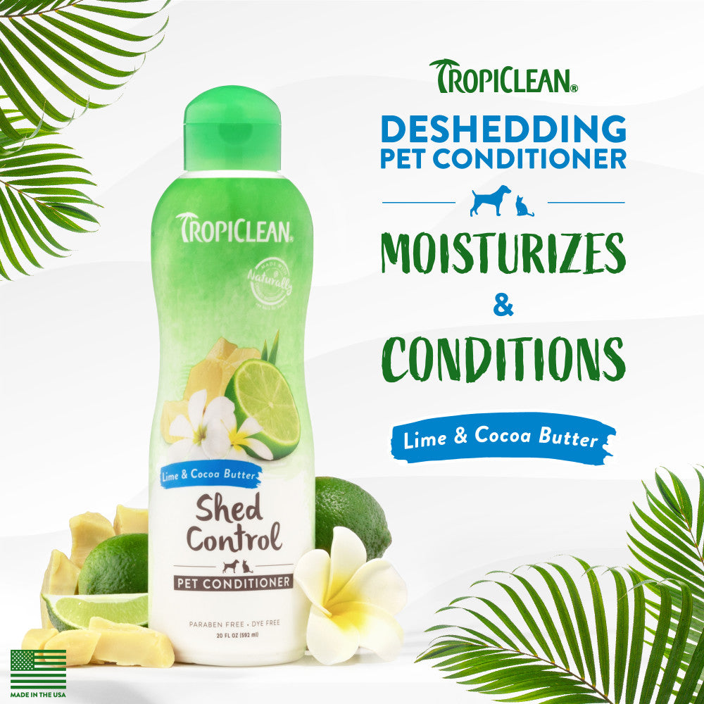TropiClean Lime & Cocoa Butter Shed Control Conditioner for Pets bottle with lime and cocoa butter ingredients on a white background with green leaves.