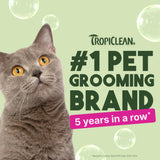 Gray cat with Tropiclean branding claiming to be #1 pet grooming brand for 5 years in a row on a light green background.