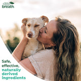 Fresh Breath Enticers Smoked Beef Brisket Oral Care Kit. Woman kissing a dog with 'TropiClean Fresh Breath' logo and text about safe, effective, naturally derived ingredients.