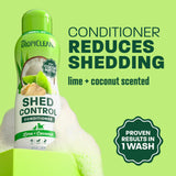 TropiClean shed conditioner bottle on light green background.