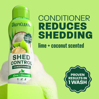 TropiClean shed conditioner bottle on light green background.