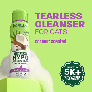 TropiClean cat shampoo bottle on light green background.