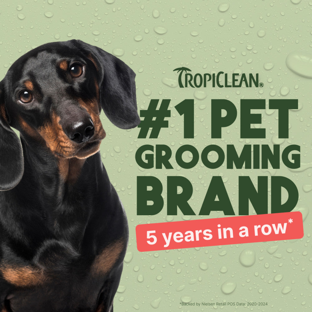 Dachshund with Tropiclean branding on a green background