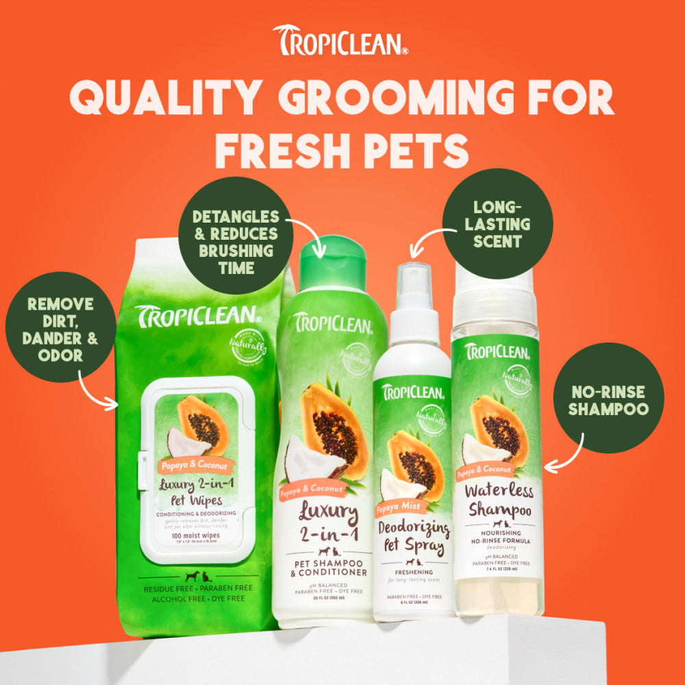 TropiClean Papaya & Coconut Luxury Pet Grooming Line on orange background