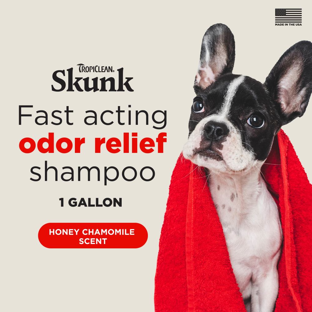 Advertisement for TropiClean Skunk Odor Control Shampoo for Dogs & Cats with a dog wrapped in a red towel.