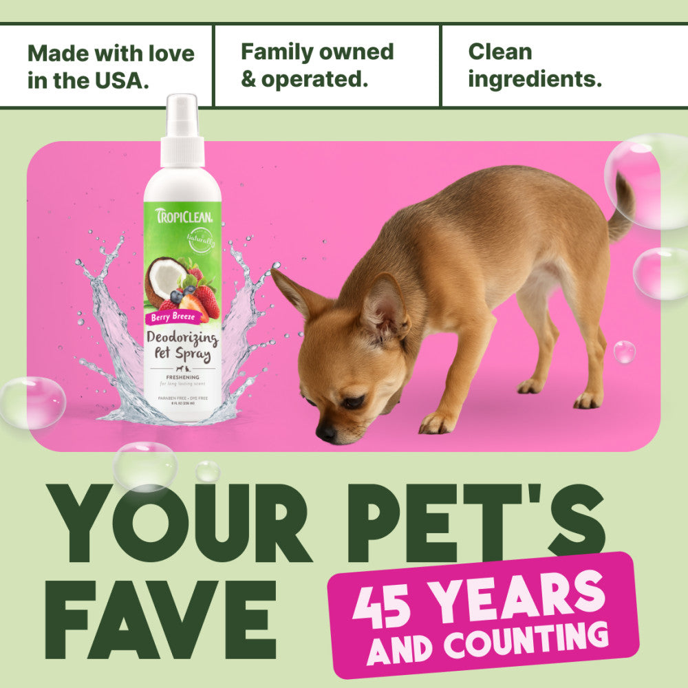 TropiClean Berry Breeze Deodorizing Spray for Pets bottle with a dog on a pink background, featuring text about family ownership and product features.
