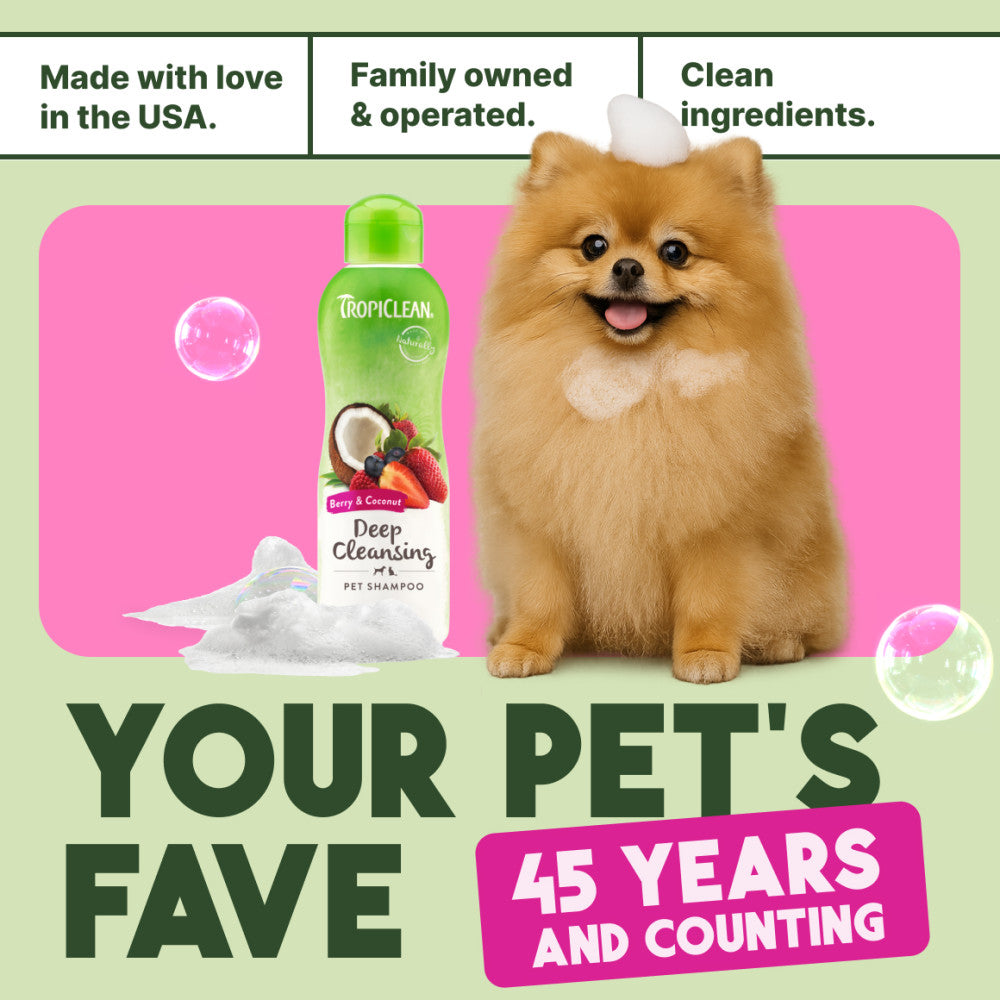 TropiClean Berry & Coconut Deep Cleansing Shampoo for Cats & Kittens bottle with a dog on a pink mat, text about family ownership and product features.