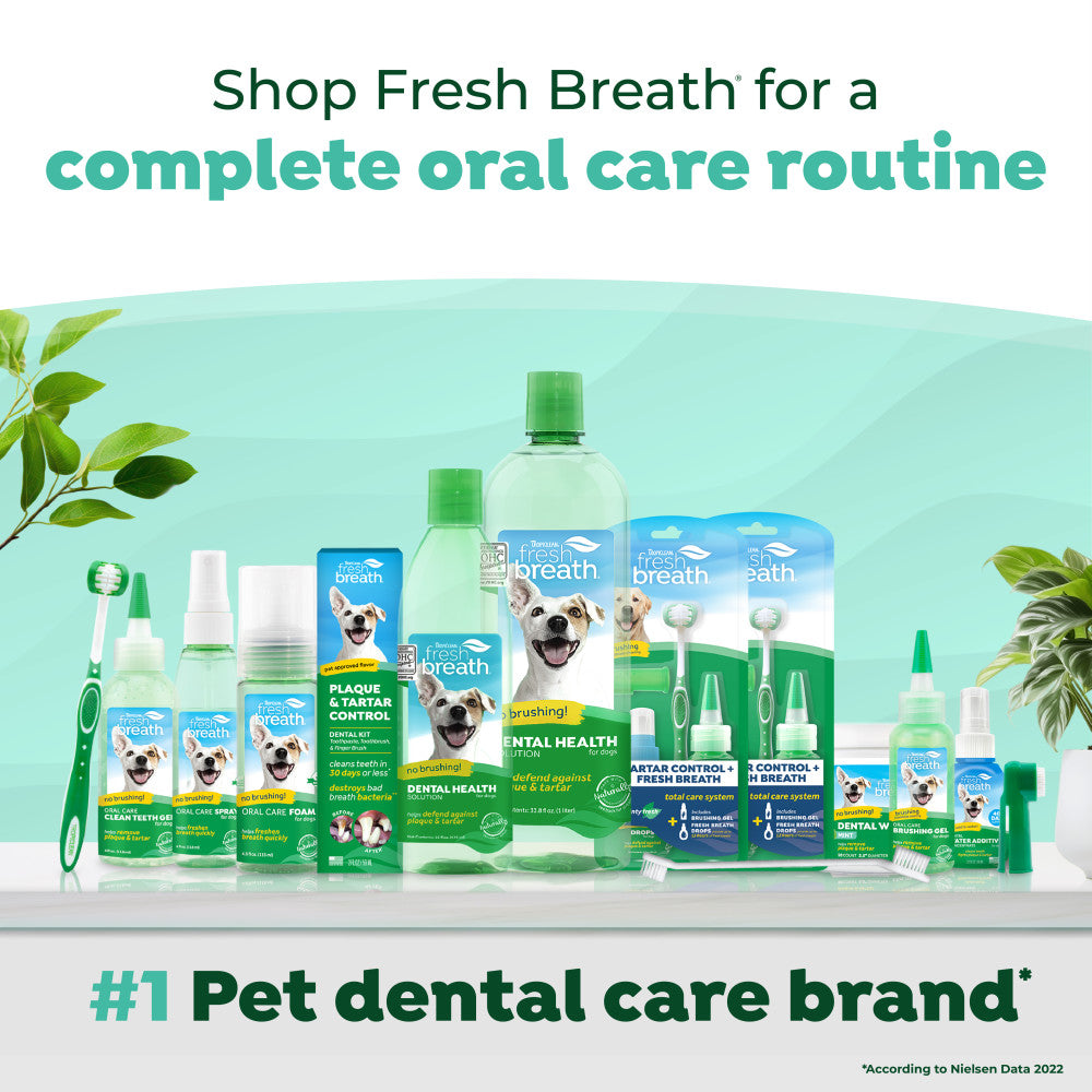 Collection of TropiClean Fresh Breath pet dental care products with a green background.