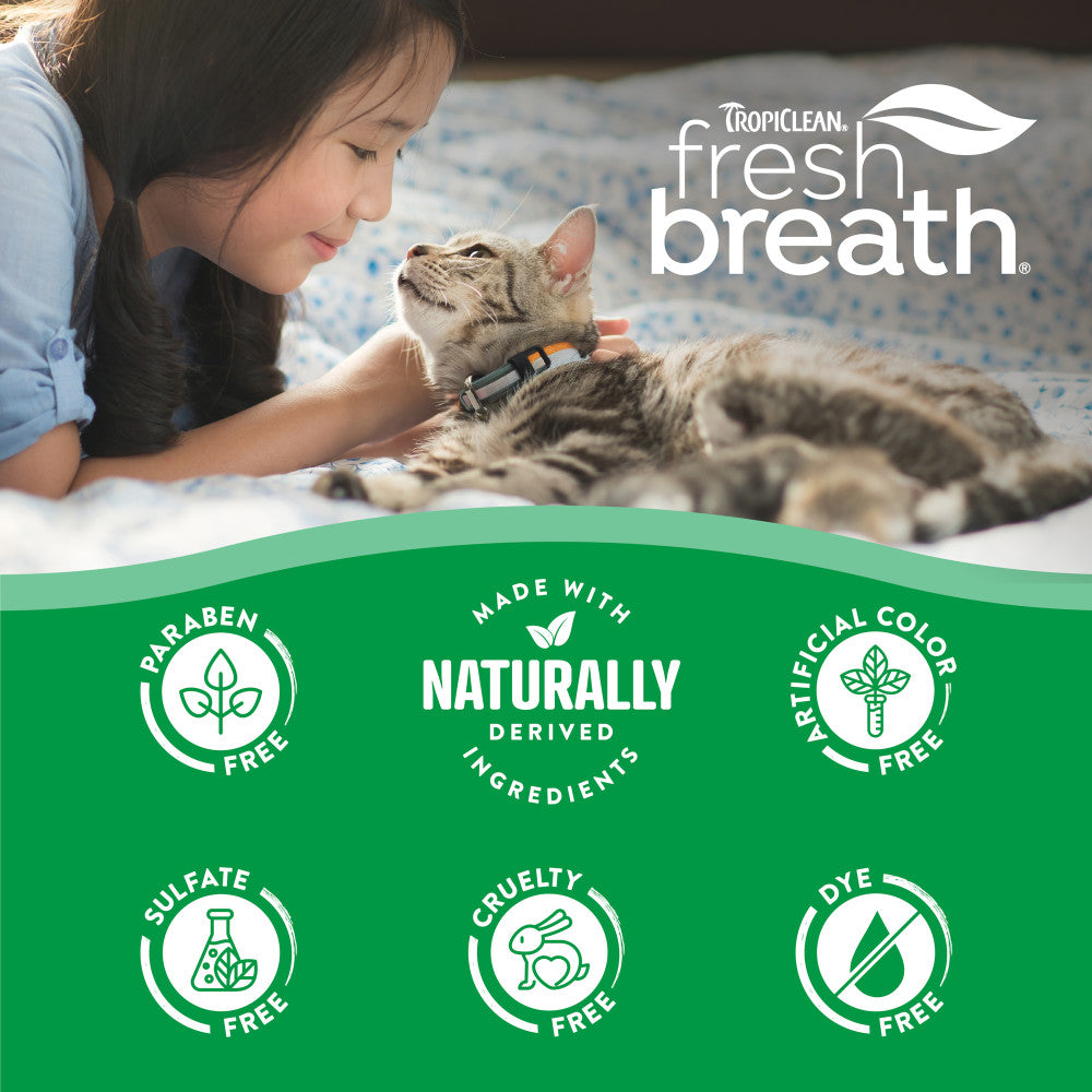 Child petting a cat with Tropiclean fresh breath branding and product benefits listed below.