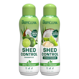 Tropiclean Shed Control Shampoo and Conditioner bottles with lime and coconut imagery on a white background